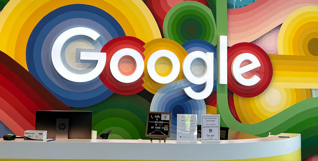 Google logo front desk at a conference