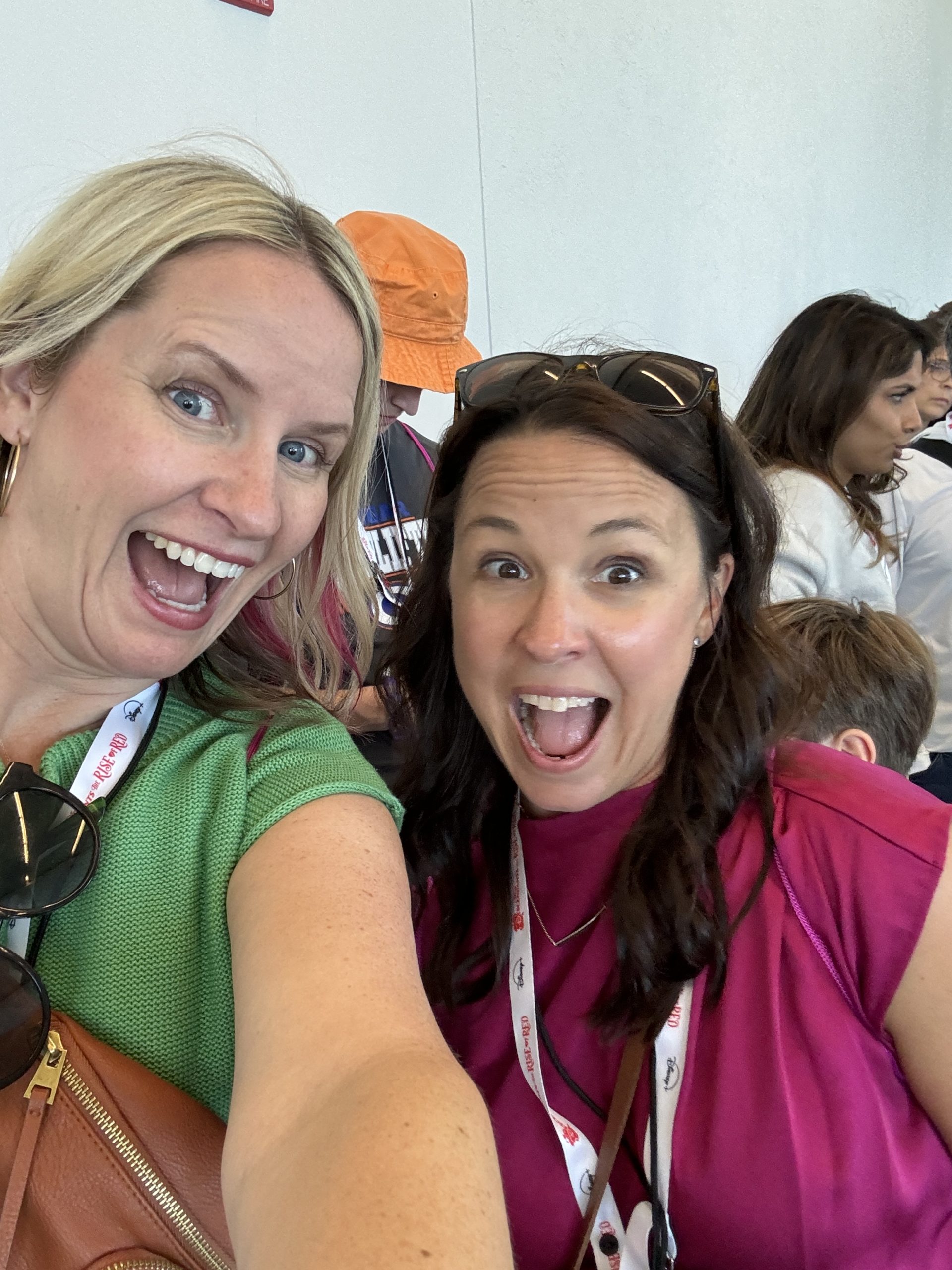 CEO, Leanne Prewitt, and COO Katie Herzog pose for a selfie among the conference crowd.