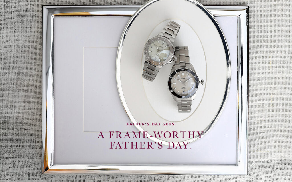 Two mens watches sitting on on a silver tray surrounded by a picture frame. Headline reads, "A frame-worth Father's Day."