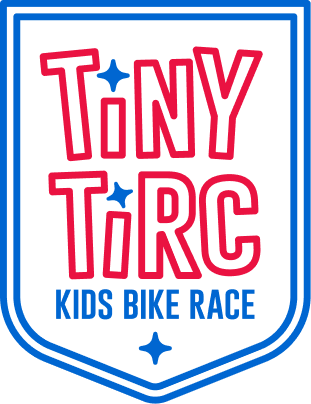 Outline of a shield with the words Tiny Tirc outlined inside.